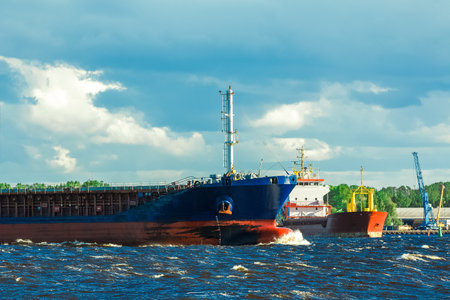 Blue bulk carrier moving in clear summer dayの写真素材
