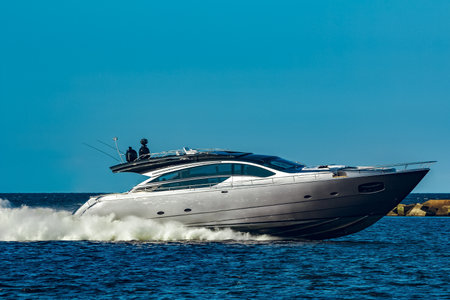 Grey speedboat moving fast by the river in Latvia. Water sportの写真素材