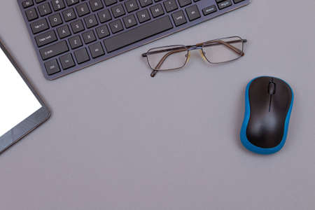 Top View of Workplace. Digital Gadgets Lying on Grey Table - Flat Layの写真素材