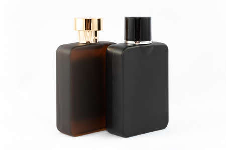 Two Matte Bottles of Perfume for Men on White Background - Close-Up. Black and Brown Blank Glass Spray Bottles with Men Perfume - Mock Upの写真素材
