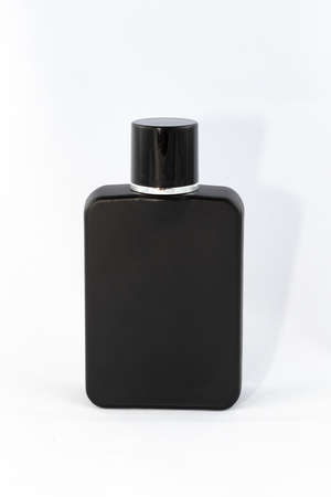 Black Matte Bottle of Perfume for Men on White Background - Close-Up. Blank Glass Spray Bottle with Men Perfume - Mock Upの写真素材