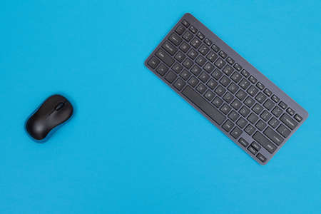 Office Workplace with Digital Gadgets Lying on Blue Table - Flat Layの写真素材