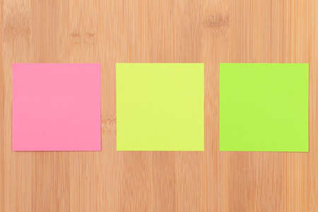 Colored Sticky Notes with Copyspace Pinned to the Wooden Message Board. To Do List Reminder in Office. Blank Memo Sticker at Work - Template. Empty Checklist - Mockupの写真素材