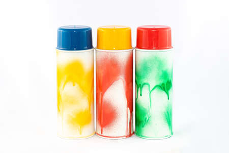 Three Colored Spray Paint Cans on White Background. Graffitis Inventory - Close-Up Shotの写真素材