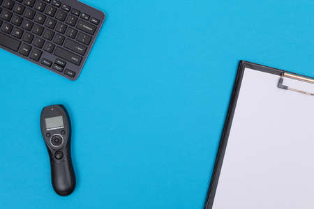 Office Workplace with Digital Gadgets Lying on Blue Table - Flat Lay