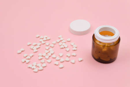 Global Pharmaceutical Industry and Medicinal Products - White Pills or Tablets Scattered from the...