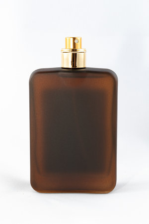 Brown Matte Bottle of Perfume for Men on White Background - Close-Up. Blank Glass Spray Bottle with Men Perfume - Mock Upの写真素材