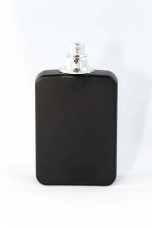 Black Matte Bottle of Perfume for Men on White Background - Close-Up. Blank Glass Spray Bottle with Men Perfume - Mock Upの写真素材