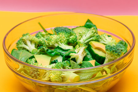Fresh Green Salad of Avocado, Broccoli, Spinach and Cucumber for Body Detoxification. Vegan Salad. Vegetarian Culture. Raw Food. Healthy Eating and Vegetable Dietの写真素材