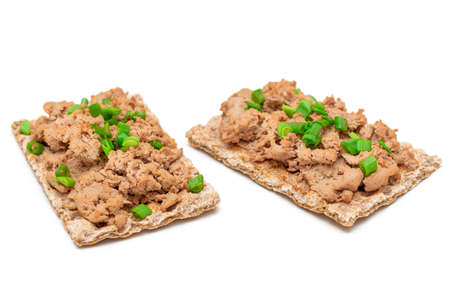 Crispy Sandwich with Chicken Pate and Green Onions Isolated on White Background - Top View. Whole Grain Bread with Liver Pate. Diet Breakfast and Healthy Foodの写真素材