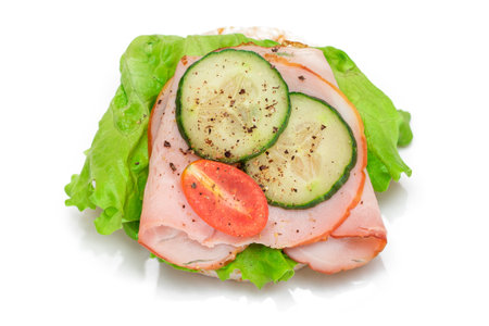 Light Breakfast. Quick and Healthy Sandwich. Rice Cake with Ham, Tomato, Fresh Cucumber and Green Salad - Isolated on Whiteの写真素材