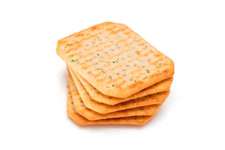 Stack of Crispy Salted Crackers with Greens - Isolated on White. Easy Snack - Isolationの写真素材