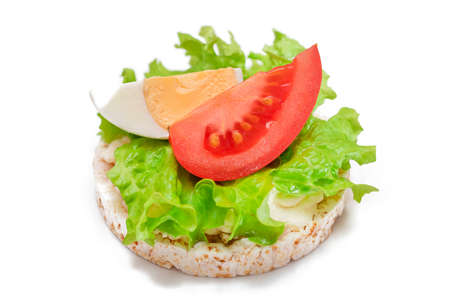 Rice Cake Sandwich with Tomato, Lettuce and Egg - Isolated on White. Easy Breakfast. Diet Food. Quick and Healthy Sandwiches. Crispbread with Tasty Filling. Healthy Dietary Snack - Isolationの写真素材