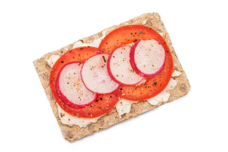Whole Grain Crispbread with Tomato, Cream Cheese and Radish - Isolated on White. Easy Breakfast. Quick and Healthy Sandwiches. Crispbread with Tasty Filling. Healthy Dietary Snack - Isolationの写真素材