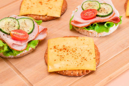 Light Breakfast. Quick and Healthy Sandwiches. Rice Cakes with Ham, Tomato, Fresh Cucumber, Green...