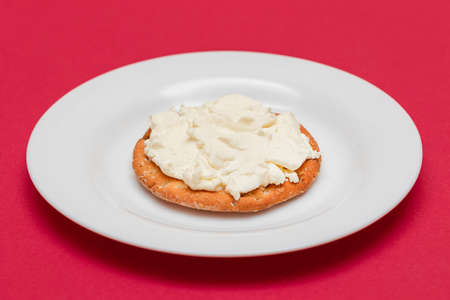 Crispy Cracker Sandwich with Cream Cheese on White Plate