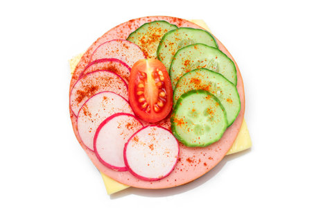 Crispy Cracker Sandwich with Fresh Cucumber, Cheese, Sausage, Radish and Tomato - Isolated on White. Quick and Healthy Sandwiches. Crispbread with Tasty Filling. Healthy Dietary Snack - Isolationの写真素材