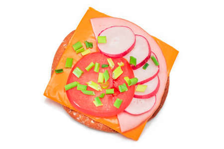 Crispy Cracker Sandwich with Tomato, Sausage, Cheese, Green Onions and Radish - Isolated on White. Easy Breakfast. Diet Food. Quick and Healthy Sandwiches. Crispbread with Tasty Filling - Isolationの写真素材