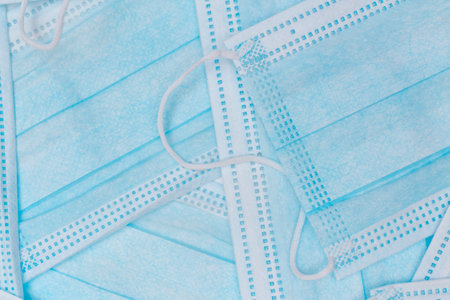 Blue Disposable Medical Face Mask Background. Trade in Medical Masks. Business During a Pandemic or...