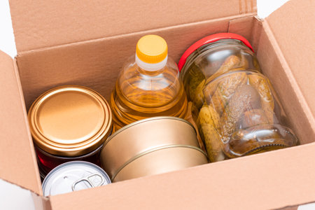 Food Reserves or Donation Box: Carton Box with Canned Food, Cereals and Grocery. Emergency Food...
