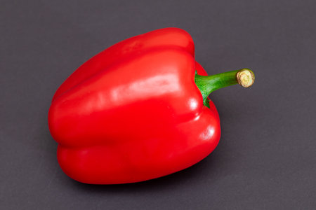 Fresh Red Sweet Bell Pepper on Black Backgroundの写真素材