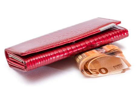 Red Leather Women Purse with Fifty Euro Banknotes - Isolated on White Background. A Wallet Full of...