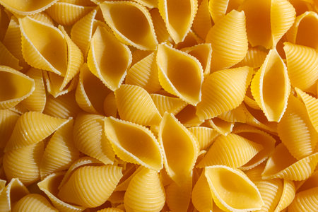 Uncooked Conchiglie Pasta: A Culinary Canvas of Conchiglie Macaroni, Creating a Lively and Textured...