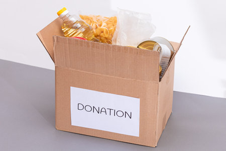 Donation Box of Free Food. Carton Box with Canned Food, Cereals and Grocery. Meal Reserves....