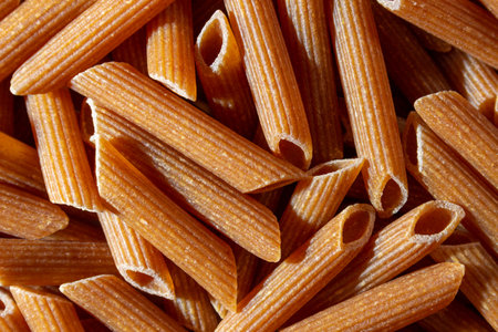Uncooked Whole Grain Penne Rigate Pasta: A Culinary Canvas of Whole Wheat Macaroni, Creating a...