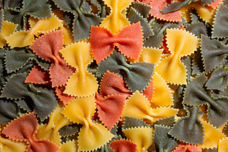 Uncooked Vibrant Colored Farfalle Pasta: A Culinary Canvas of Multicolored Bow-Tie Macaroni,...