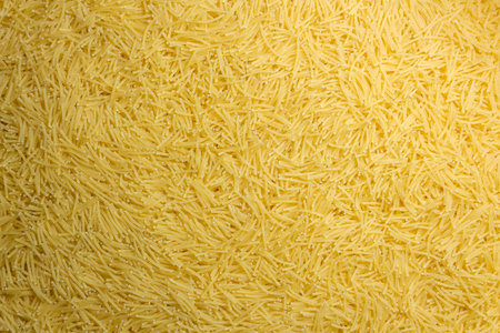 Uncooked Filini Pasta: A Culinary Canvas of Noodles, Creating a Lively and Textured Background for Gourmet Cooking. Dry Pasta. Raw Macaroni - Top View, Flat Layの写真素材