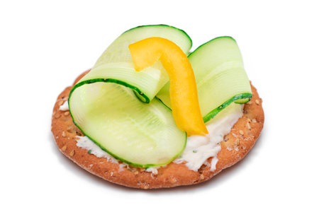 Crispy Cracker Sandwich with Fresh Cucumber, Yellow Paprika and Cottage Cheese - Isolated on White. Easy Breakfast. Quick and Healthy Sandwiches. Crispbread with Tasty Filling. Healthy Dietary Snackの写真素材