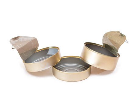 Three Opened Empty Tin Cans Isolated on White Background. Clean Used Aluminum Cans - Isolation. Non-Degradable Inorganic Wasteの写真素材