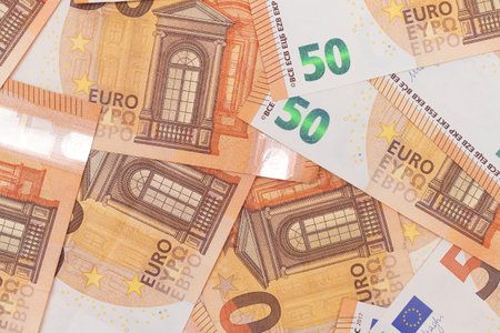 50 Euro Banknotes Money Background. Euro Money Currency. Orange Paper Money. A Lot of Fifty Euro...