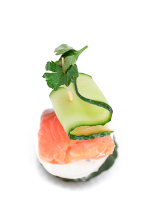 Canapes without Bread with Fresh Salmon, Cucumber and Cream Cheese - Isolated on White Background. Easy Breakfast. Diet Food. Quick and Healthy Sandwiches. Healthy Snacks with Tasty Fillingsの写真素材