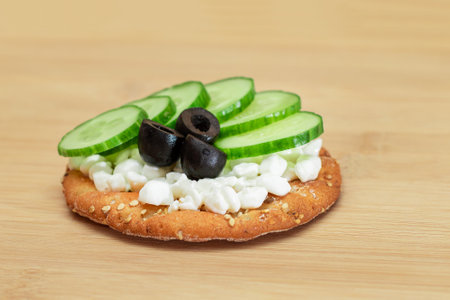Crispy Cracker Sandwich with Fresh Cucumber, Cottage Cheese and Olives on Cutting Board. Diet Food. Easy Breakfast. Quick and Healthy Sandwiches. Crispbread with Tasty Filling. Healthy Dietary Snackの写真素材