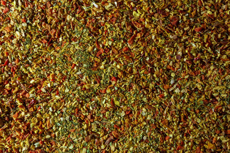 Vibrant and Colored Vegetable Seasoning Mix: A Culinary Canvas of Aromatic Seasoning - Textured Background for Gourmet Cooking. The Harmonious Combination of Fresh Herbs and Spices - Top Viewの写真素材