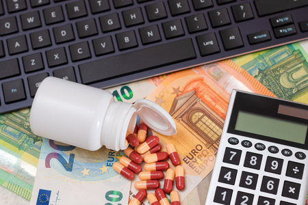 Ordering Medicines. Expensive Medicine and Inflation Concept: Pills and Capsules on the Euro Banknotes. Global Pharmaceutical Industry and Big Pharma. Trade in Medicinesの写真素材