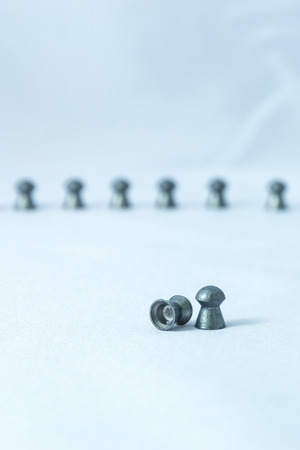 Sport shooting equipment on target. Airgun and bullets.の写真素材