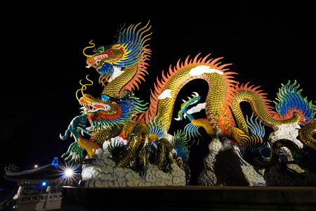 Dragon sculpture on black backgrounの写真素材
