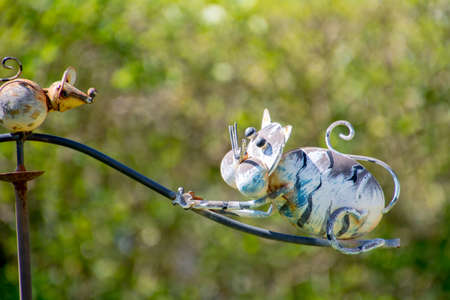 Cat chases mouse on Greyhoundの写真素材