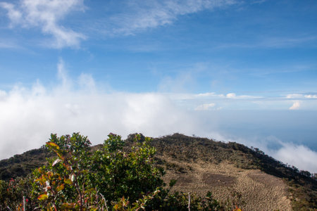 Mountain view with blue sky and white cloudsの写真素材