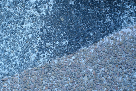 Granite pebbles as a background texture, closeup of photoの写真素材