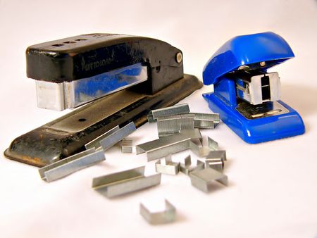 And old stapler and a new stapler with staplesの写真素材