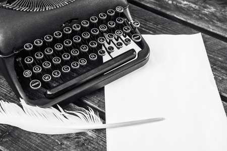 Antique vintage typewriter in on a wooden tableの写真素材