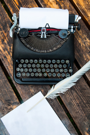 Antique vintage typewriter in on a wooden tableの写真素材
