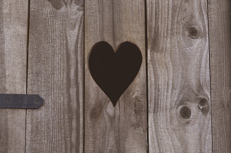 Rural wooden toilet WC, heart on the boardの写真素材