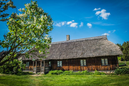 Old house in forest. Open-air ethnography museum near Riga, Latvia.の写真素材