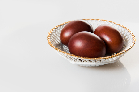 Easter eggs painted in natural onion bark isolated on a whiteの写真素材