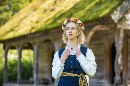 Latvian woman in traditional clothing. Ligo folk.